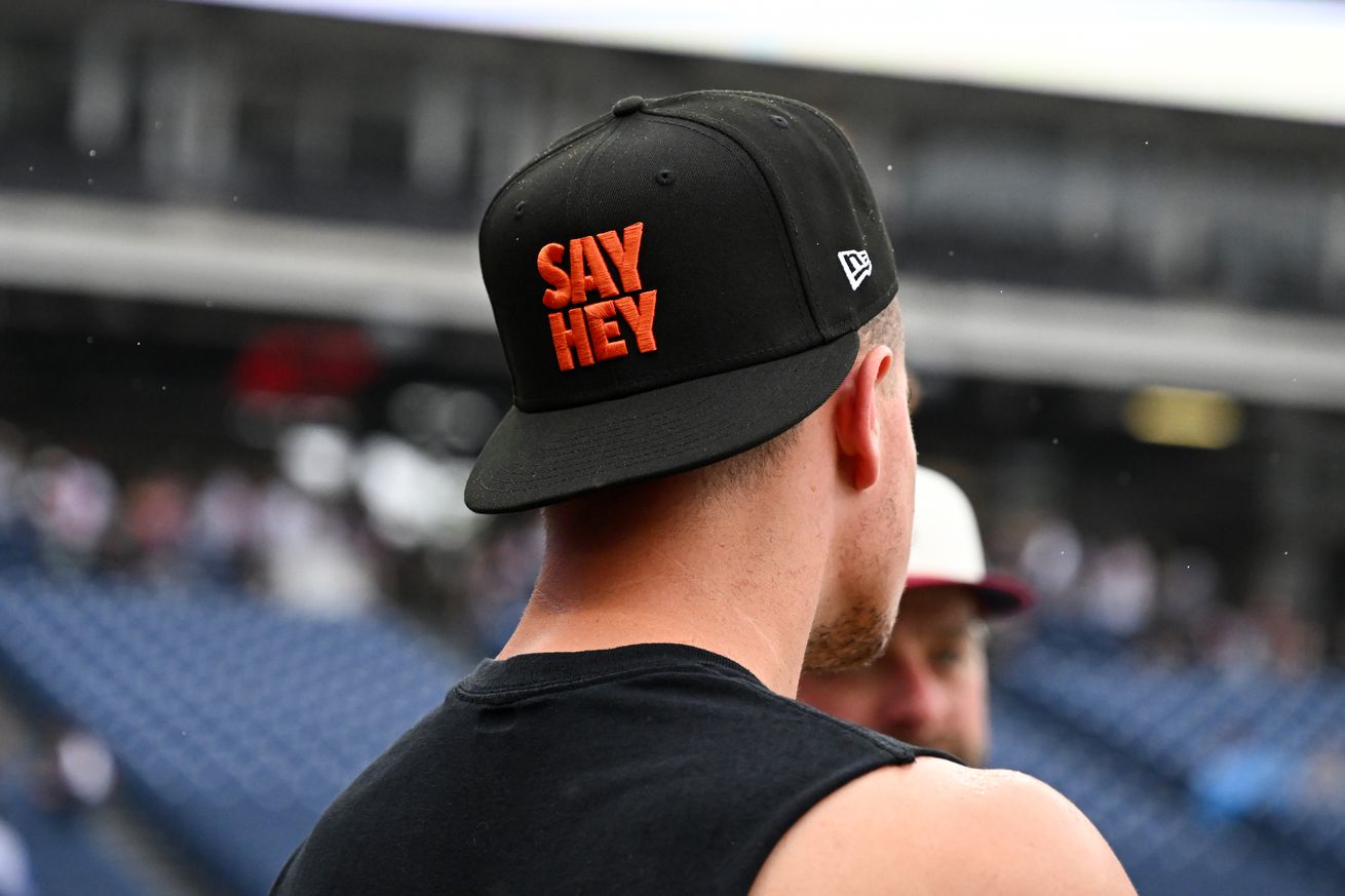 Matt Chapman wearing a backwards hat that says “Say Hey”