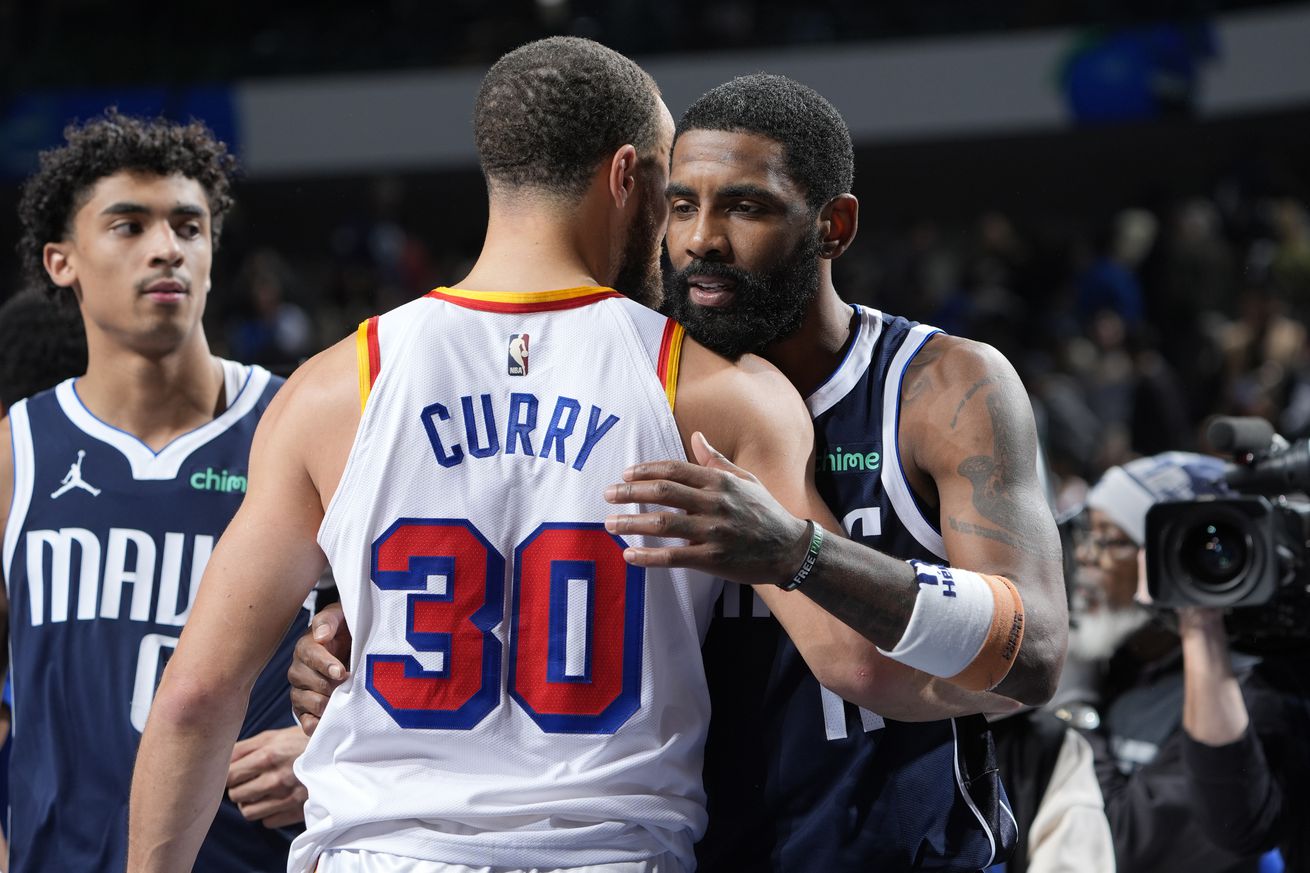 Steph Curry hugging Kyrie Irving. 