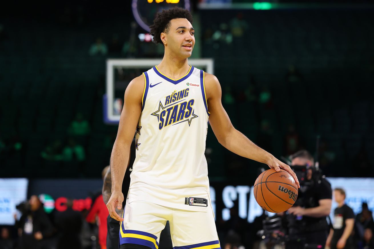 Trayce Jackson-Davis dribbling a ball in warmups in a Rising Stars jersey. 