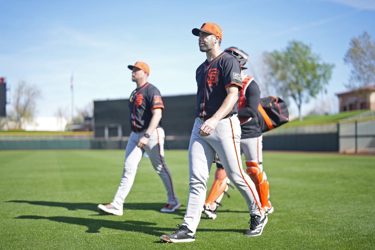 Justin Verlander leading a group of Giants walking in Spring Training. 