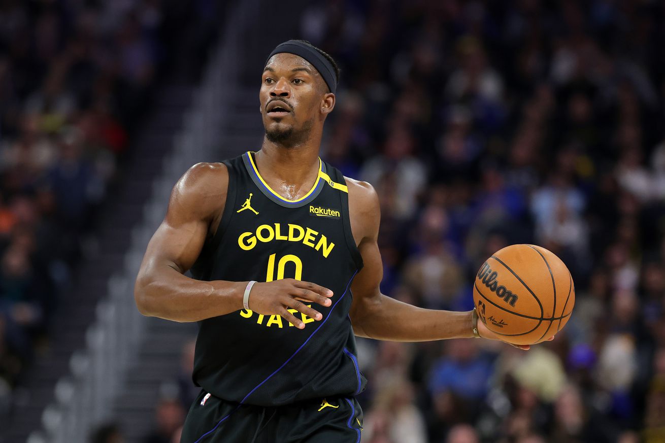 immy Butler III #10 of the Golden State Warriors dribbles the ball against the Charlotte Hornets at Chase Center on February 25, 2025 in San Francisco, California.