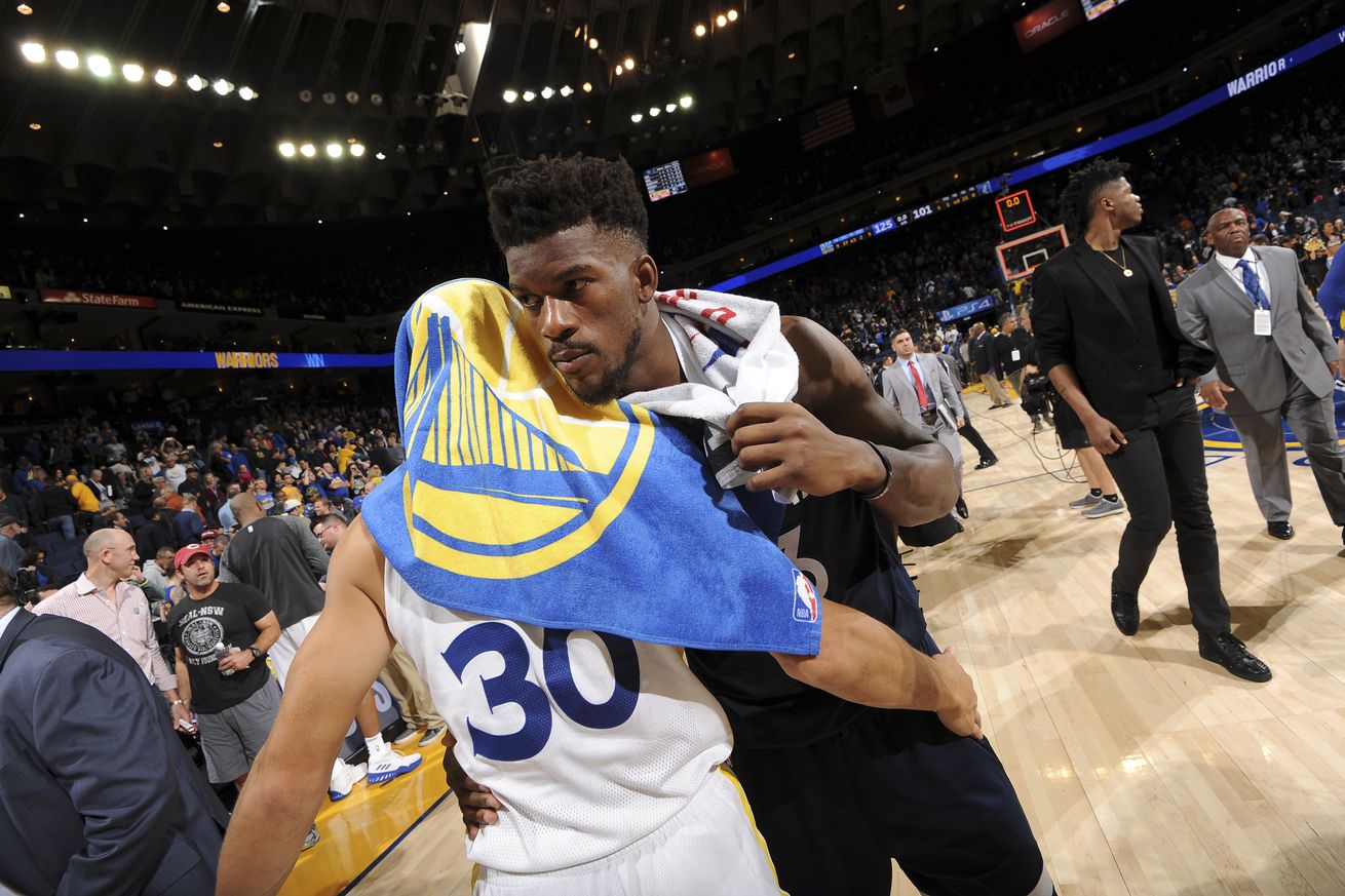 Jimmy Butler hugging Steph Curry after a game. 