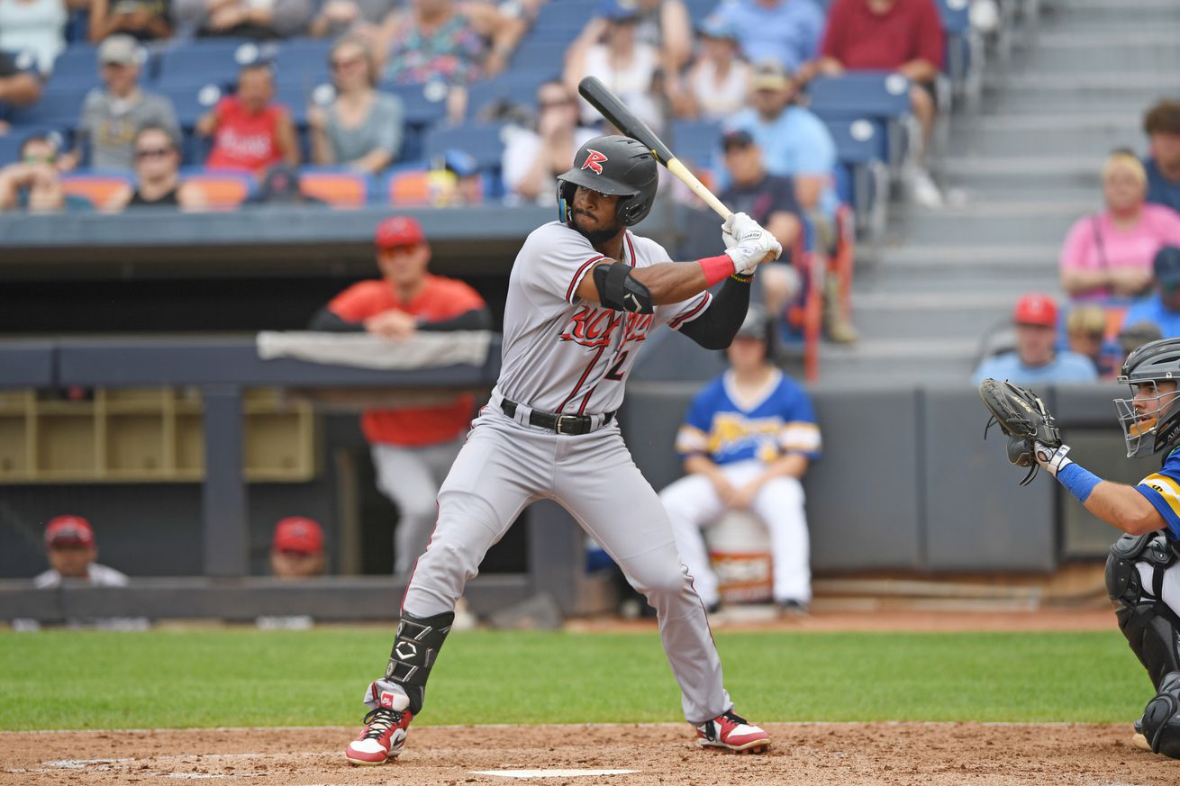 VIew from the side of Jairo Pomares in the batter’s box in a Richmond jersey. 