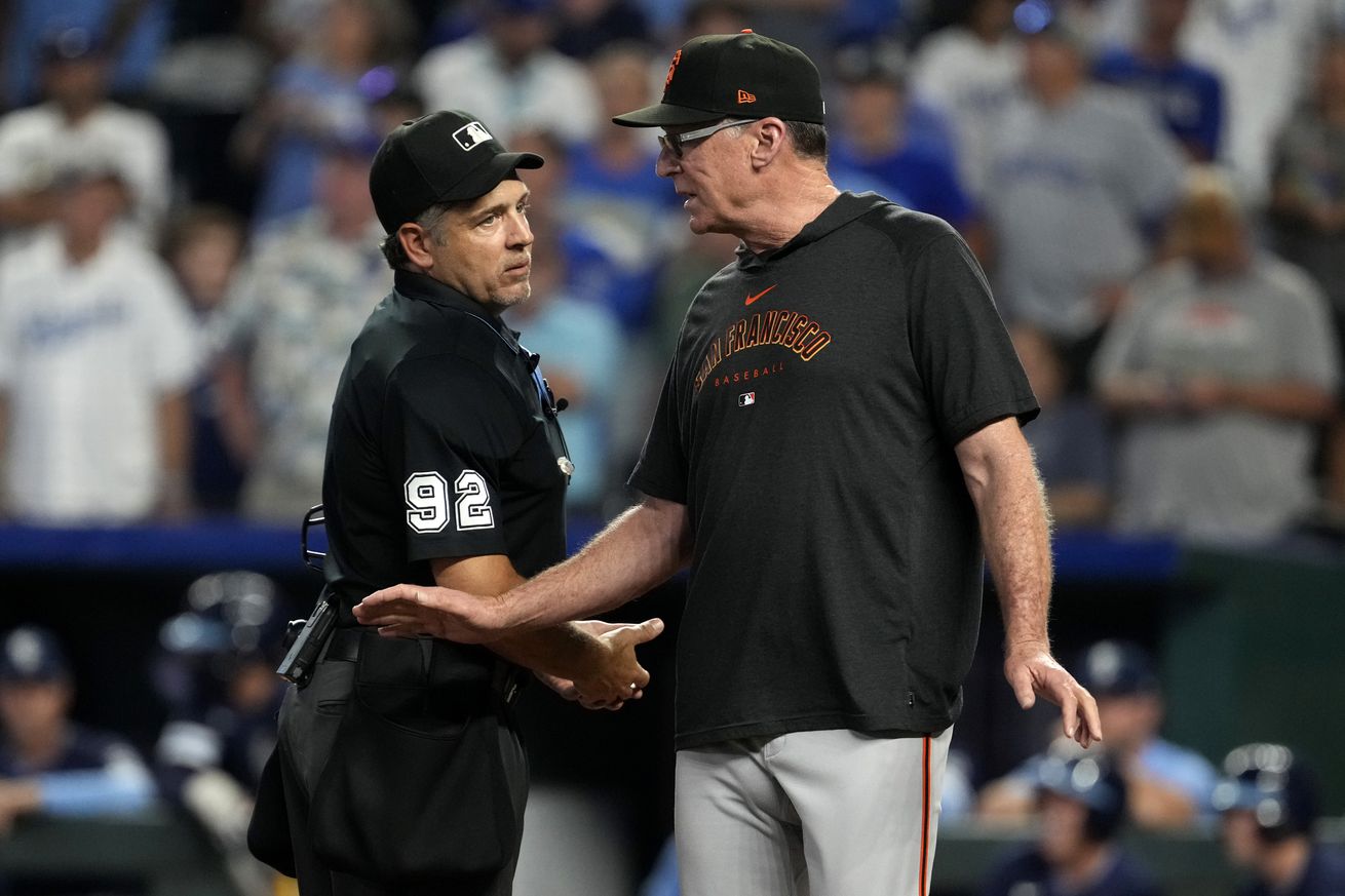 Bob Melvin having a heated discussion with an umpire.