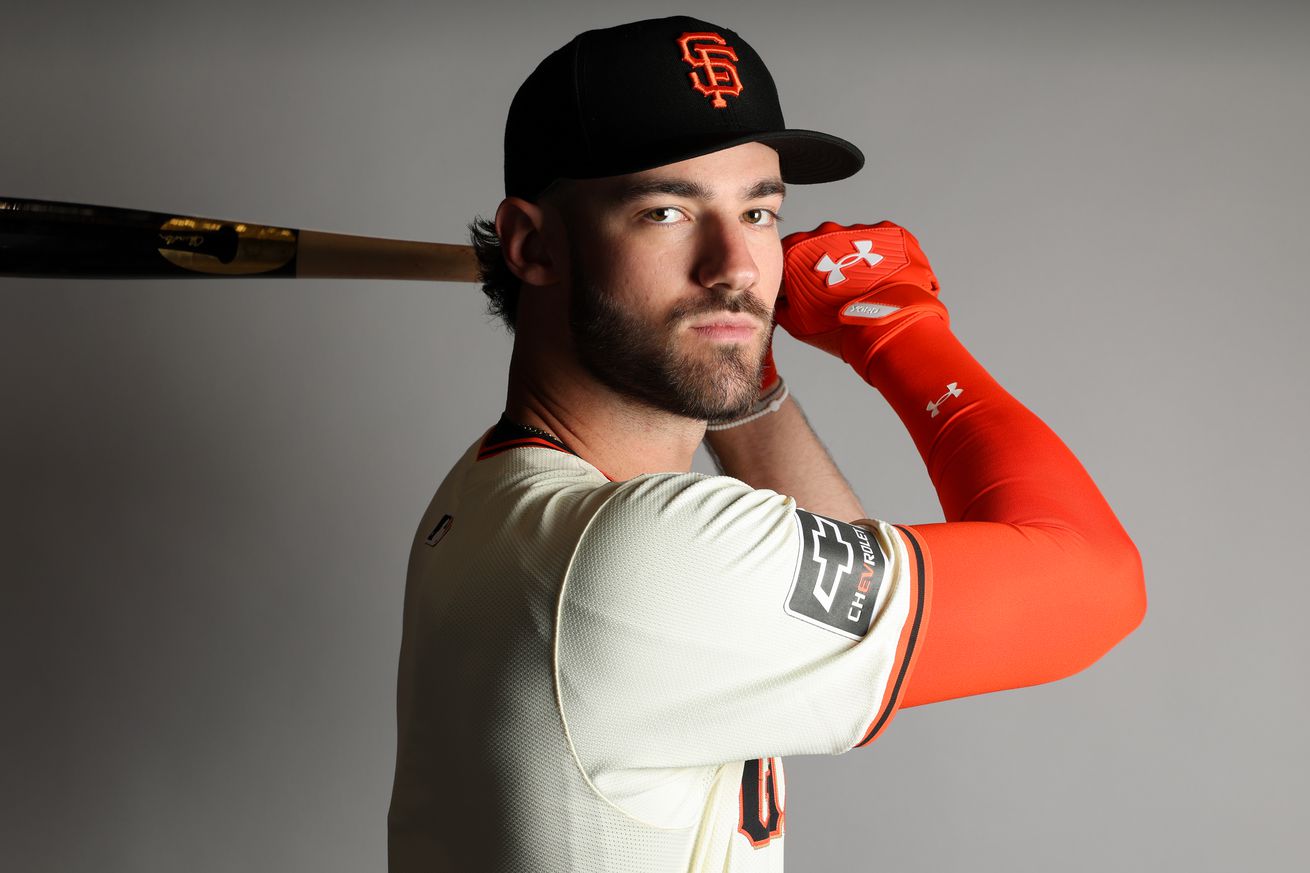 Close up of Bryce Eldridge holding a bat on his shoulder, posing for media day. 