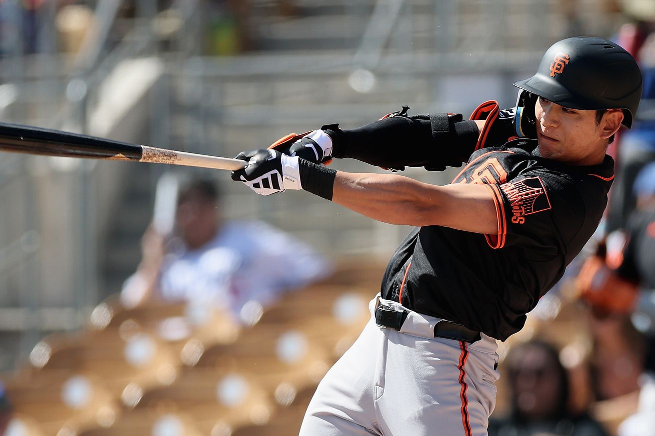 Jung Hoo Lee swinging a bat. 