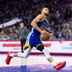 Mar 1, 2025; Philadelphia, Pennsylvania, USA; Golden State Warriors guard Stephen Curry (30) drives for a dunk against the Philadelphia 76ers during the fourth quarter at Wells Fargo Center.